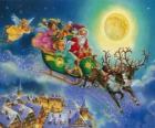 Санта-Клаус в санях пролетел над домами в канун Рождества